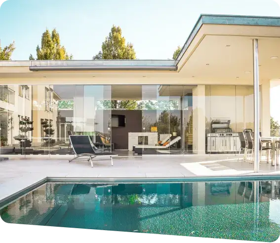 A modern home featuring a pool and patio, designed for short-term rental at Outland.